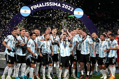 Argentina's Lionel Messi holds a trophy as he celebrates with his teammates after winning the Finalissima soccer match between Italy and Argentina at Wembley Stadium. (Photo | AP)