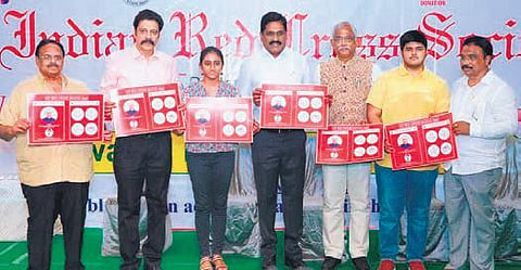 Principal Secretary (Health) MT Krishna Babu launching the ‘AP Red Cross Blood’ app developed by Sai Akashara Vemuri (third, left) of Vijayawada