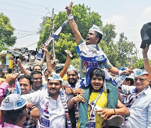 AAP workers and members celebrate party candidate Durgesh Pathak’s win in Rajinder Nagar by-elections on Sunday | Parveen negi