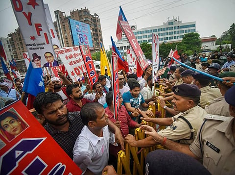Police personnel stop student-activists during their Vidhan Sabha march in protest against the 'Agnipath' scheme, in Patna, Wednesday, June 29, 2022. (Photo | PTI)