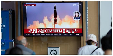 People watch a TV screen showing a news program reporting about North Korea's missile launch with file image, at a train station in Seoul on Sunday, June 5, 2022 (Photo | AP)