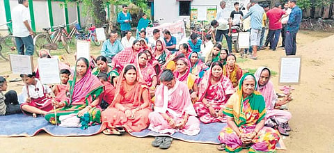 Guardians sit on dharna in front of Kujang block education office. (Photo | Express)