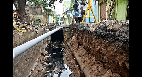 Metro Water pipeline stuck in the slab of stormwater drain at Ernavoor. (Photo | P Jawahar)