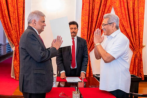 President Gotabaya Rajapaksa, right, greets prime minister Ranil Wickremesinghe during the latter's oath taking ceremony as the new finance minister in Colombo, May 25, 2022. (File Photo | AP)