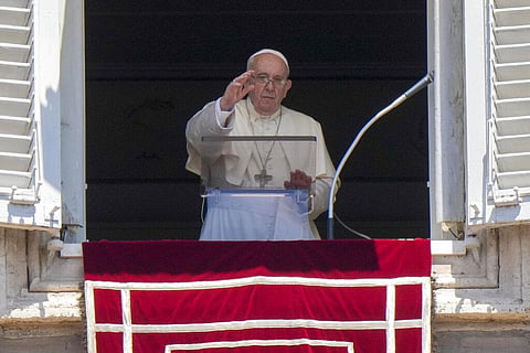 Pope Francis delivers his blessing as he recites the Angelus noon prayer from the window . (Photo | AP)
