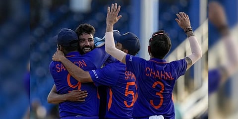 Teammates embrace Mohammed Siraj after defeating West Indies for 3 runs in their first ODI cricket match .(Photo | AP)