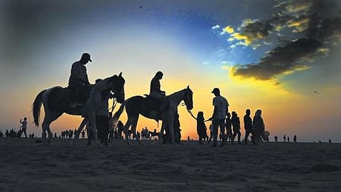 A scene from the Veli beach, where tourists are seen enjoying horse rides
