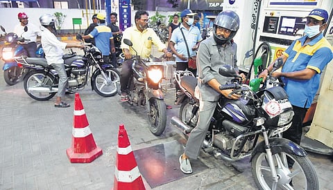 People queue up to fill petrol at a fuel station in Chennai. (File Photo | R Satish Babu)