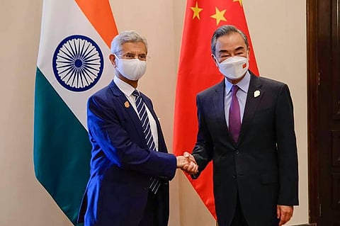 External Foreign Minister Subrahmanyam Jaishankar with Chinese Foreign Minister Wang Yi during their bilateral meeting ahead of the G20 Foreign Ministers' Meeting in Nusa Dua. (Photo | PTI)