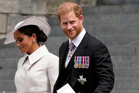 Prince Harry and his wife Meghan, Duchess of Sussex, depart after attending a service of thanksgiving for the reign of Queen Elizabeth II at St Paul's Cathedral in London. (Photo | AP)