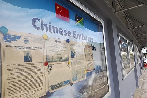 A display case of photos is seen outside the Chinese Embassy in Honiara, Solomon Islands on April 2, 2022. (File Photo | AP)