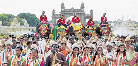 Caparisoned elephants, which arrived from their jungle camps for the Dasara festivities, being welcomed at Mysuru Palace on Wednesday | Udayashankar S