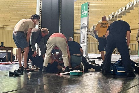 Author Salman Rushdie is tended to after he was attacked during a lecture, Friday, Aug. 12, 2022, at the Chautauqua Institution in Chautauqua. (Photo | AP)