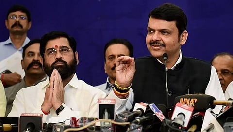 Deputy CM and BJP leader Devendra Fadnavis speaks as Maharashtra CM and Shiv Sena leader Eknath Shinde looks on during a press conference, in Mumbai. (Photo | PTI)