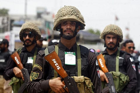 Pakistan army stand along the route of a Shiite Muslim's Muharram procession, in Karachi, Pakistan, Sunday, Aug. 7, 2022. (Photo | AP)