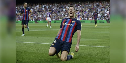 Barcelona's Robert Lewandowski celebrates after scoring his side's opening goal during a Spanish La Liga soccer match between FC Barcelona and Valladolid CF at the Camp Nou.(Photo | AP)