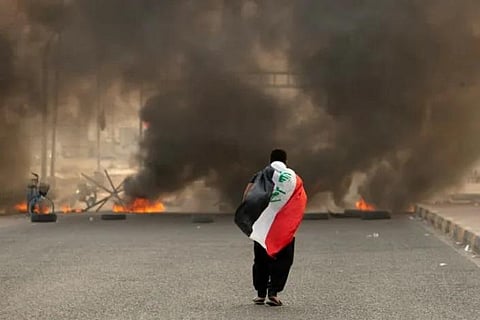 Iraqi supporters of powerful cleric Moqtada Sadr began withdrawing Tuesday from Baghdad's Green Zone after he demanded to end fighting. (Photo | AFP)
