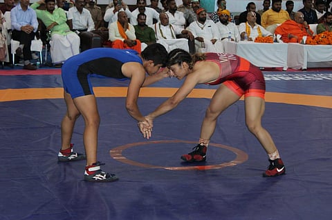 Vinesh Phogat (R) defeated Antim Panghal 7-0 to qualify for the Worlds