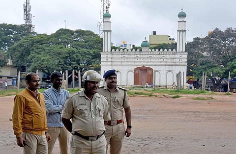 Police personnel keep vigil at Idgah Maidan in Bengaluru. (Photo| Vinod Kumar T)