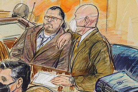 Guy Wesley Reffitt, joined by his lawyer William Welch, right, in Federal Court, in Washington. (Photo | AP)