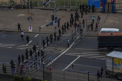 Army soldiers stand guard after removing the protesters and their tents from the site of a protest camp outside the Presidential Secretariat in Colombo, Sri Lanka. (Photo | AP)