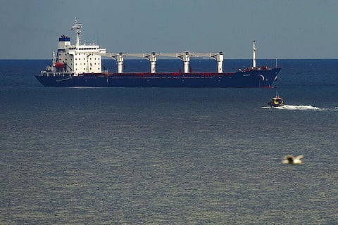 A boat with Russian, Ukrainian, Turkish and U.N. officials heads to the cargo ship to check if the grain shipment is in accordance with a crucial agreement. (Photo | AP)