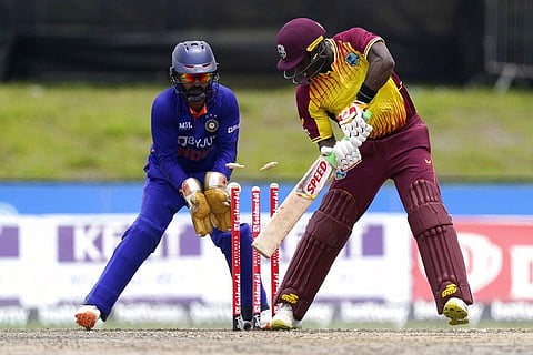 West Indies' Devon Thomas, right, is bowled by India's Axar Patel during the fifth and final T20 cricket match. (Photo | AP)