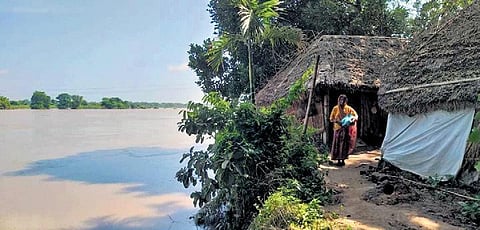 Rekha Sethi standing in front of her house near Karandia river | Express