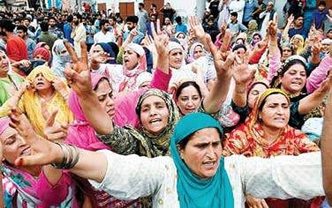 Women shouting slogans during funeral prayers for one of the militants killed in the overnight encounter with security forces in Budgam district, at Hyderpora in Srinagar. (File Photo | PTI)