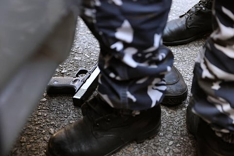 Members of the Lebanese security forces gather in front of the bank after the heist. (AFP Images)