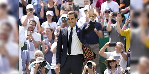 Roger Federer waves during the 100 years of Centre Court celebration at Wimbledon tennis championships on July 3, 2022.(File Photo | AP)