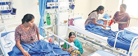 Family members attend to women who were admitted in NIMS, on Thursday | Vinay Madapu