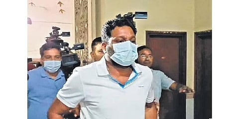 Builder Srinivasa Rao being taken to the ED office for questioning for his alleged links to Robin Distilleries of Ramachandran Pillai, one of the accused in the Delhi liquor scam case