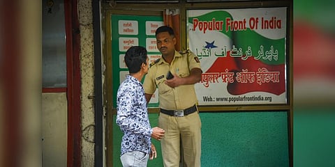 A security person keeps vigil outside the Popular Front of India (PFI) party office in Navi Mumbai, Thursday, Sept. 22, 2022.(PTI Photo)