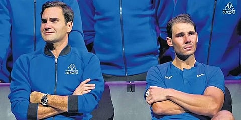 An emotional Roger Federer (left) of Team Europe sits alongside his playing partner Rafael Nadal after their Laver Cup doubles match against Team World’s Jack Sock and Frances Tiafoe (Photo | PTI)