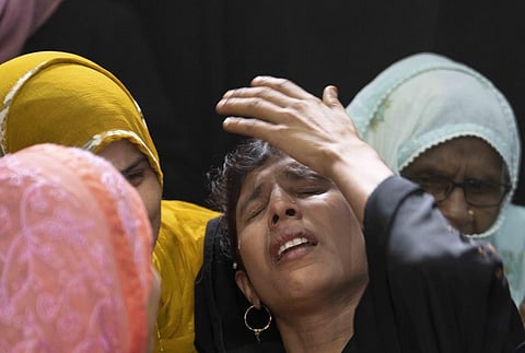 Relatives mourn by the body of Mohamed Usman, 15, who was killed by lightning on Friday at Prayagraj, in Uttar Pradesh. (Photo | PTI)