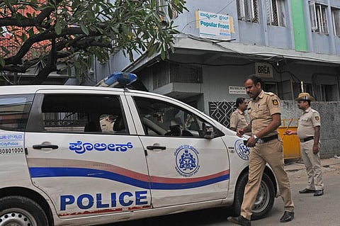 Police personnel keep vigil at PFI’s state office in SK Garden, after it was announced that the outfit was banned, in Bengaluru on Wednesday | vinod kimar t
