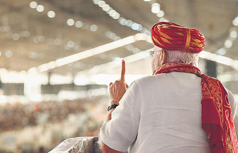 PM Narendra Modi addresses the inauguration and foundation stone laying ceremony of various projects at Bhavnagar in Gujarat on Thursday. (Photo | PTI)