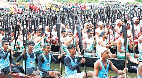 Rowers hold their oars high during the Nehru Trophy Boat Race mass drill in Alappuzha on Sunday | T P Sooraj