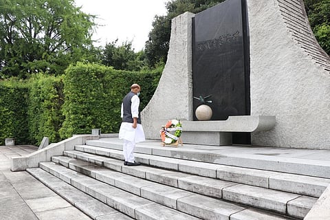 Rajnath Singh paying tribute to Japan's defense personnel who laid their lives in the line of duty.