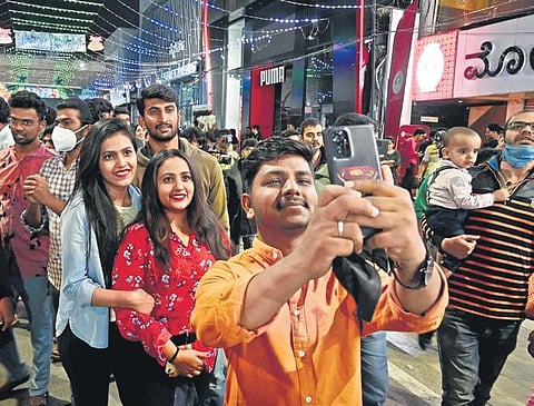 Revellers take a selfie on Brigade Road to usher in the New Year in Bengaluru on Saturday | Shashidhar Byrappa