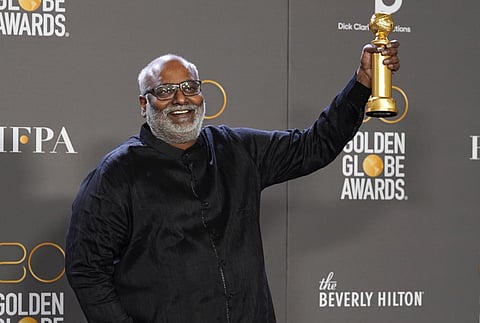 Music composer MM Keeravani holds the Golden Globe trophy for his 'Naatu Naatu' song win. (Photo | AP)
