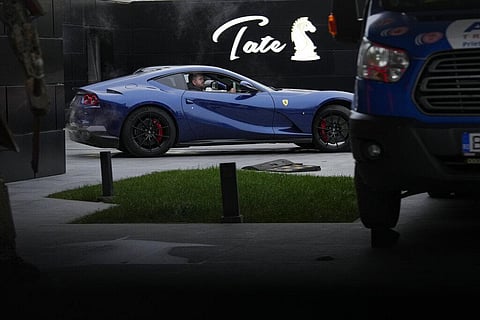 A luxury vehicle which was seized in a case against media influencer Andrew Tate, is towed away, on the outskirts of Bucharest, Romania on Jan. 14, 2023 | AP