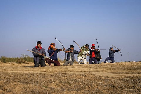 A group of local men practice archery on a ridge overlooking the Laitlum Canyon about 20km from Shillong, India, Sunday, Jan. 22, 2023. (Photo | AP)