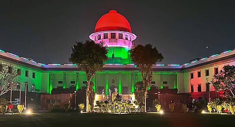 The Supreme Court of India is illuminated in the colours of national flag on the Republic Day's eve. (Photo | PTI)