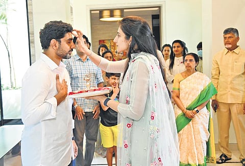 Brahmani, wife of TDP national general secretary Nara Lokesh, applies tilak to him as he leaves his Hyderabad home to set off for his padayatra, Yuva Galam | Express