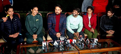Union Sports Minister Anurag Thakur with wrestlers Bajrang Punia, Vinesh Phogat, Babita Phogat, Sakshi Malik and Ravi Dahiya at a press conference in New Delhi. (Photo | PTI)