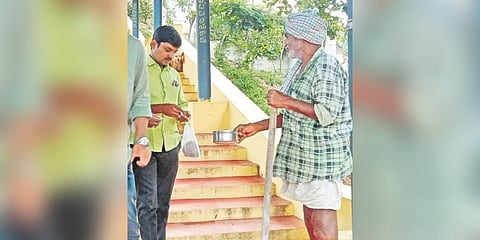 M Bichyanayak begs for alms at the entrance to a temple. (Photo | EPS)