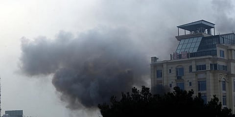 Smoke rises from a hotel building after an explosions and gunfire in the city of Kabul, Afghanistan, Monday, Dec 12, 2022.
