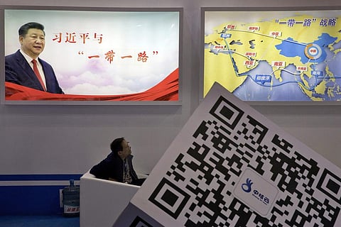 FILE - A portrait of Chinese President Xi Jinping with the words 'Xi Jinping and One Belt One Road' and 'One Belt One Road strategy,' in Beijing, April 28, 2017. (Photo | AP)